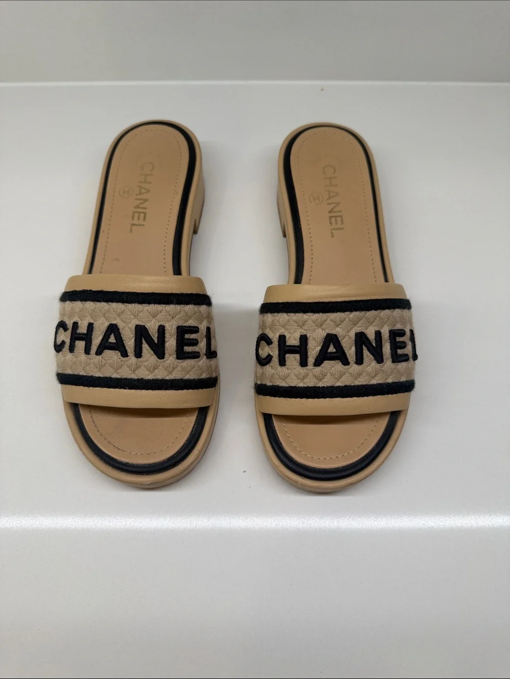 CHANEL Tan and Black Quilted Logo Slide Mules